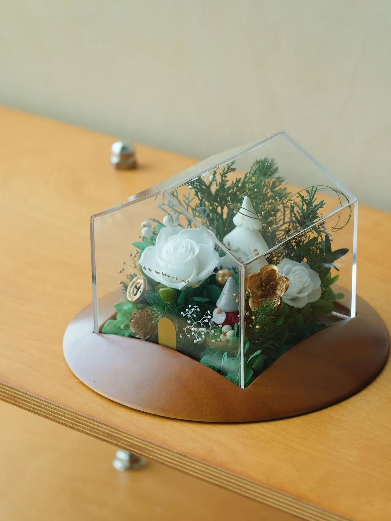 Preserved floral arrangement in an acrylic house